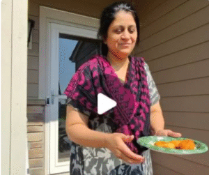 Indian woman serves medu vadas